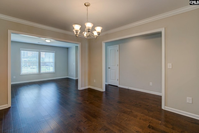 empty room with crown molding, dark hardwood / wood-style flooring, and a chandelier