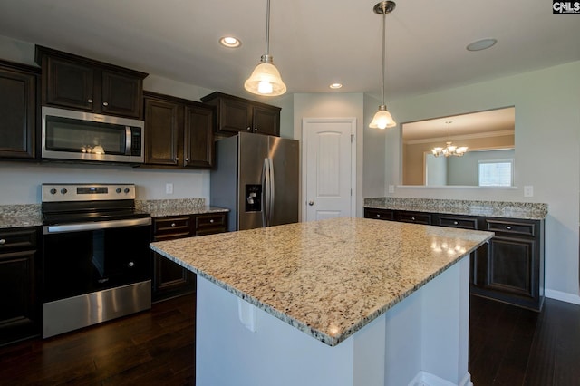 kitchen with a center island, stainless steel appliances, dark hardwood / wood-style flooring, pendant lighting, and dark brown cabinets