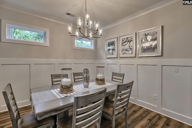 dining area featuring an inviting chandelier, a wealth of natural light, dark wood-type flooring, and crown molding