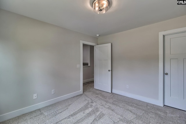 unfurnished bedroom with light carpet