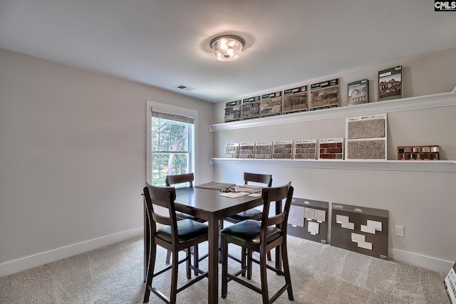 dining area featuring carpet floors