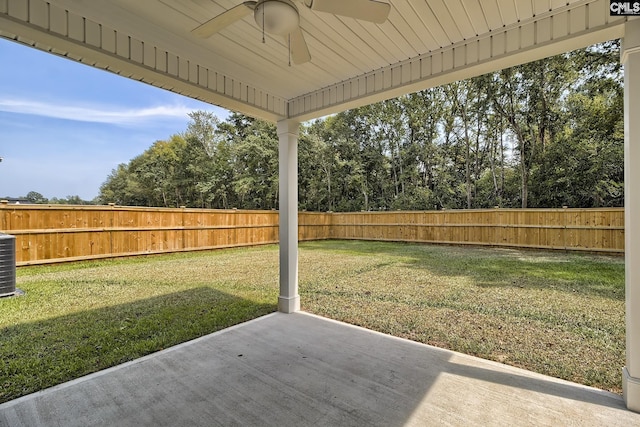 view of yard featuring a patio area and ceiling fan