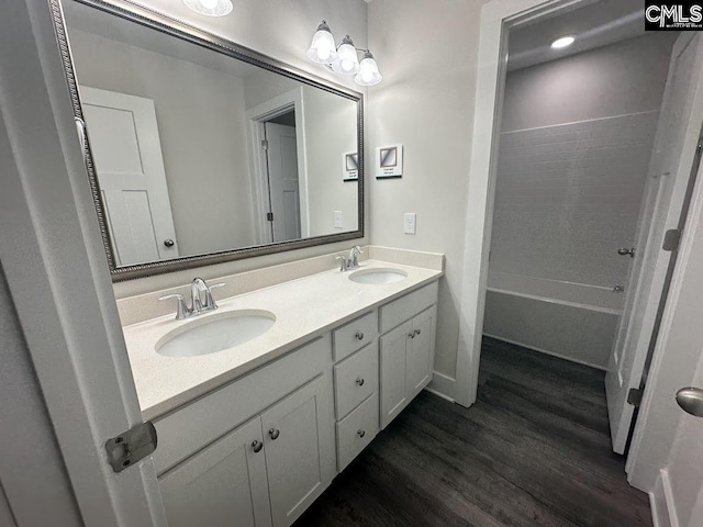 bathroom featuring wood-type flooring and vanity