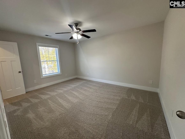 empty room featuring ceiling fan and carpet floors