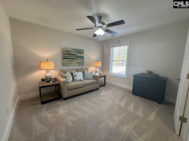 carpeted living room with ceiling fan