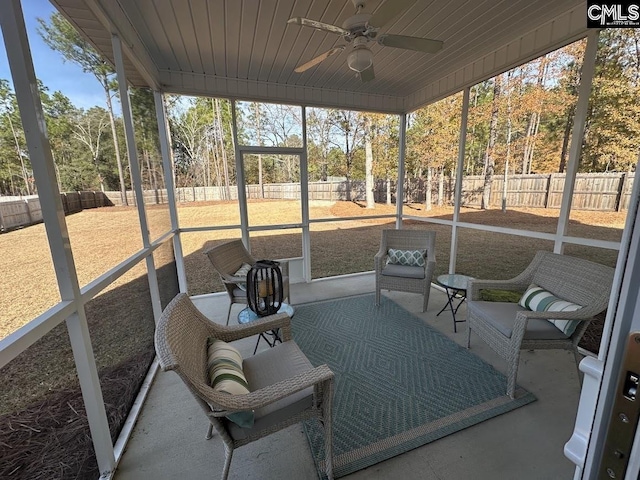 sunroom / solarium with ceiling fan and wood ceiling