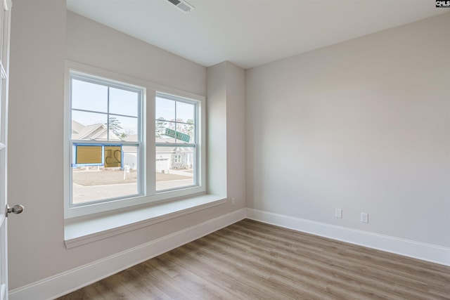 unfurnished room featuring light hardwood / wood-style floors