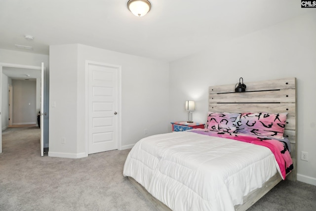 bedroom featuring light colored carpet