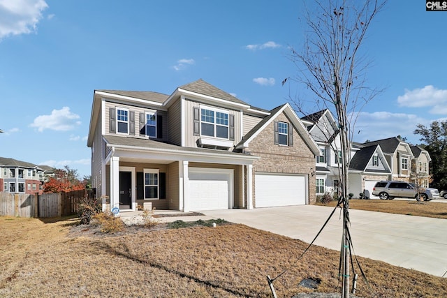 view of front of property with a porch and a garage