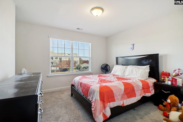 bedroom featuring light colored carpet