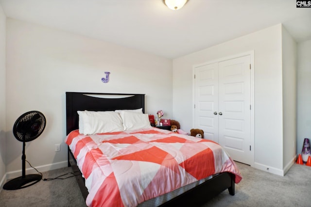 carpeted bedroom with a closet