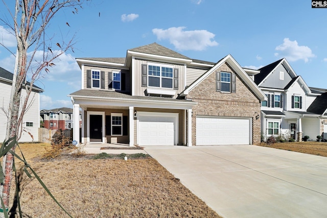 view of front of home with a porch and a garage