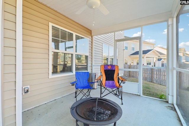 sunroom with plenty of natural light and ceiling fan