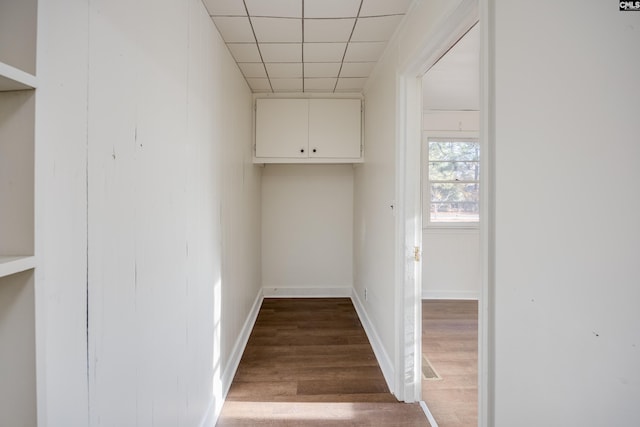 laundry area featuring wood-type flooring