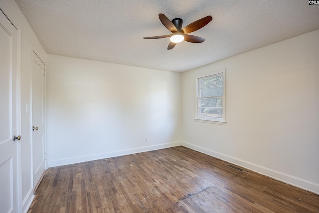 spare room featuring a textured ceiling, hardwood / wood-style flooring, and ceiling fan