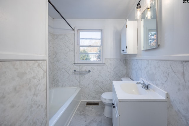 full bathroom featuring ornamental molding, vanity,  shower combination, tile walls, and toilet