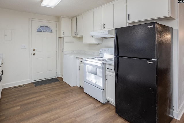 kitchen with white cabinetry, black refrigerator, white electric range oven, and light wood-type flooring