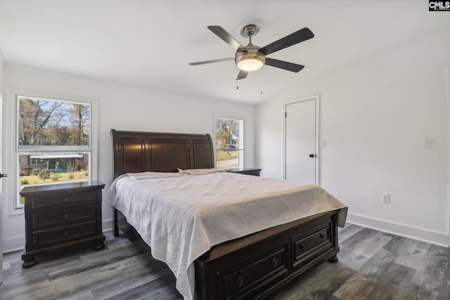 bedroom featuring dark hardwood / wood-style flooring and ceiling fan