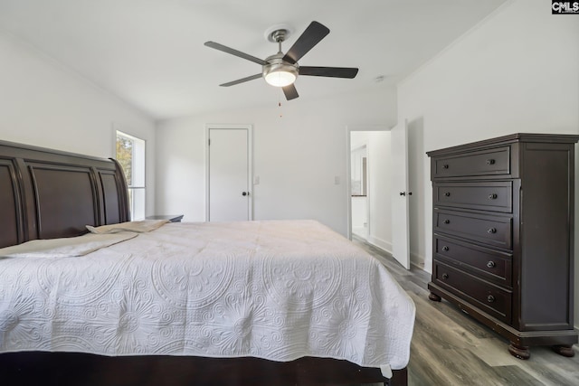 bedroom featuring ceiling fan, wood-type flooring, and lofted ceiling