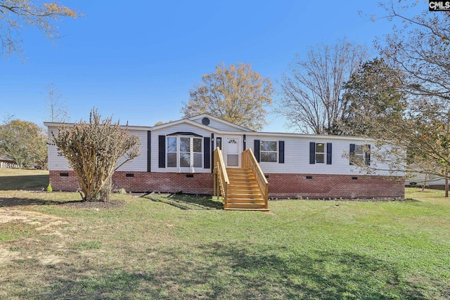 manufactured / mobile home with a front lawn