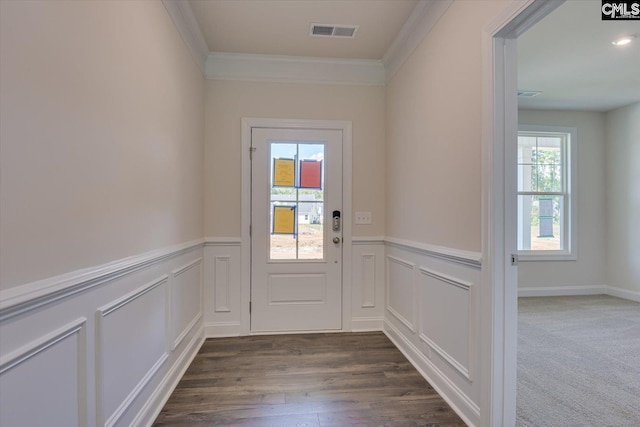 doorway with dark hardwood / wood-style flooring, plenty of natural light, and ornamental molding