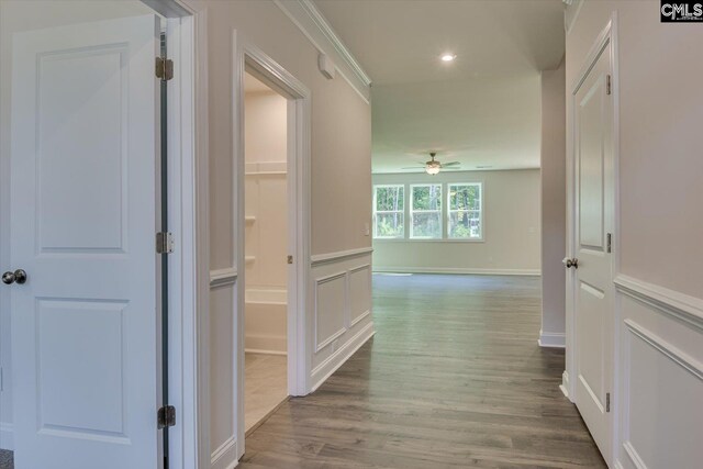 hall with hardwood / wood-style flooring