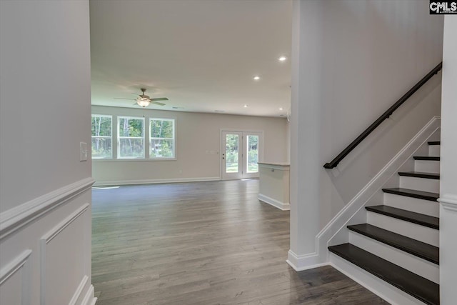 interior space with ceiling fan, light wood-type flooring, and french doors