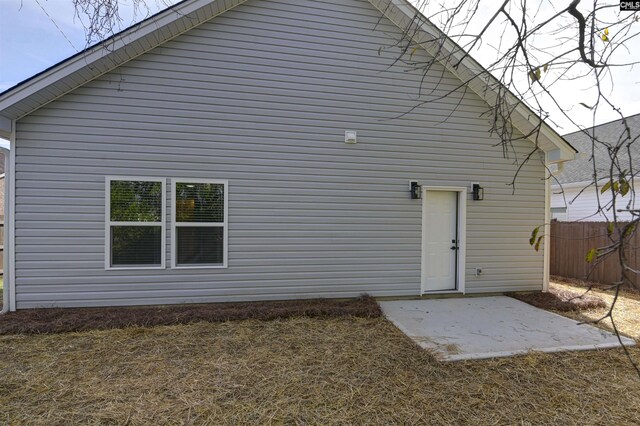 back of property featuring a patio