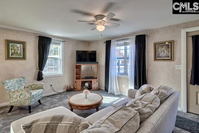 living room with carpet, ceiling fan, and a wealth of natural light