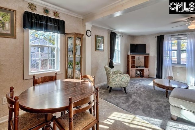 carpeted dining space with ceiling fan