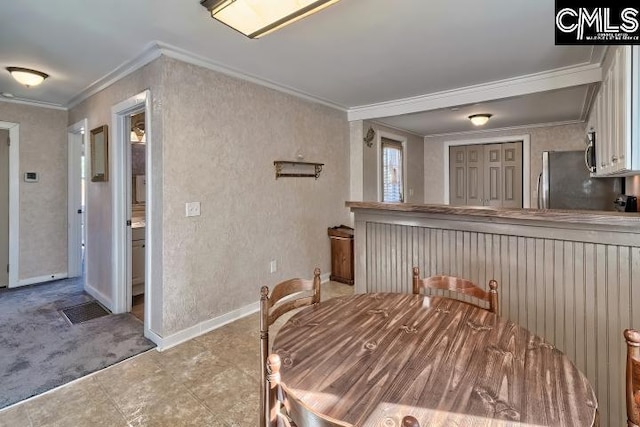 dining room with ornamental molding