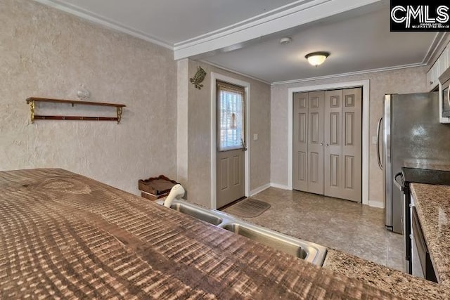 interior space with ornamental molding, sink, and a closet