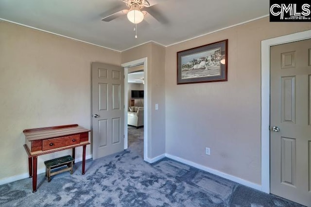 interior space featuring carpet and ceiling fan