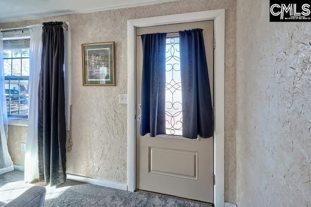 foyer with carpet floors