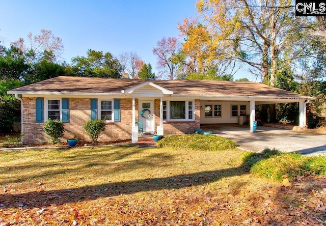 ranch-style home with a front lawn and a carport