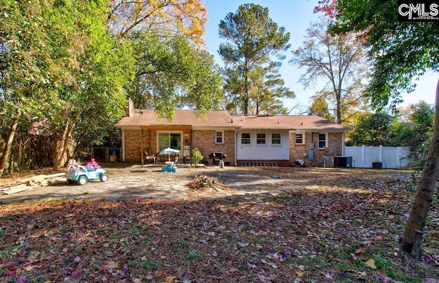 rear view of house with cooling unit