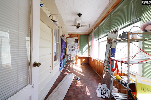 sunroom / solarium with ceiling fan and plenty of natural light