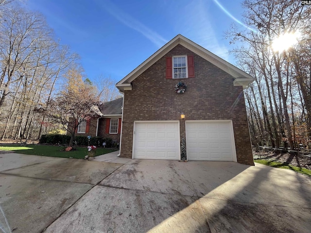 view of side of property with a garage