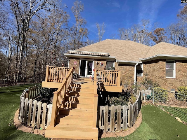 exterior space featuring a deck and a yard