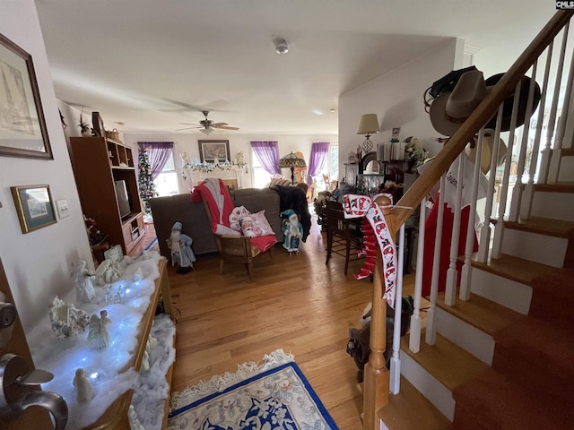 interior space with ceiling fan and light hardwood / wood-style floors