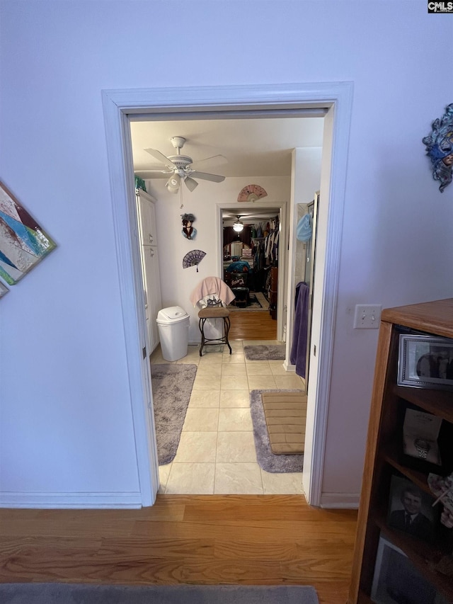 corridor with light hardwood / wood-style floors