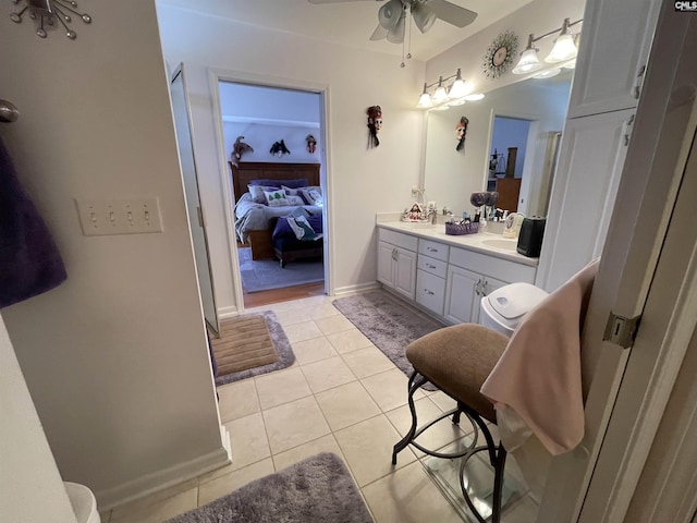 bathroom featuring ceiling fan, tile patterned flooring, and vanity