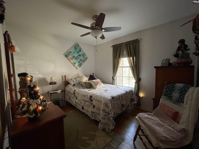 bedroom featuring ceiling fan and dark hardwood / wood-style flooring