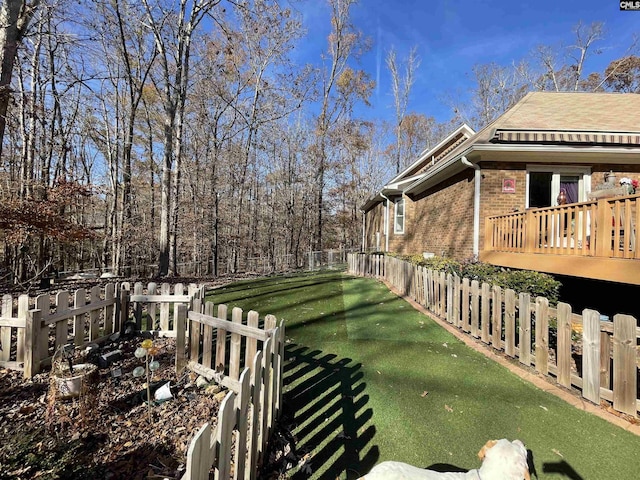 view of yard with a wooden deck