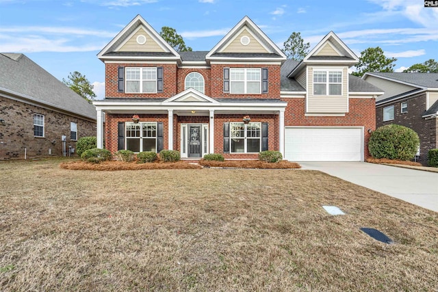 view of front of home with a front lawn and a garage