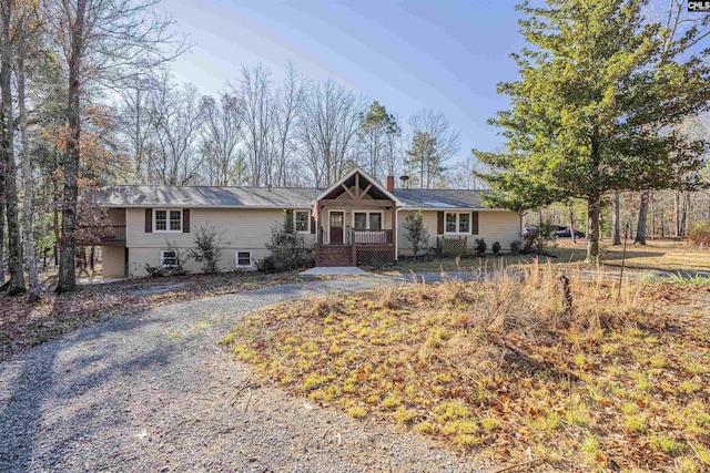 ranch-style home featuring covered porch