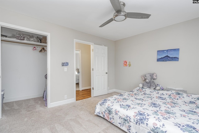 carpeted bedroom with a closet and ceiling fan