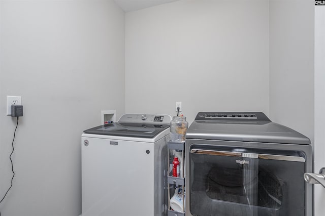 clothes washing area with independent washer and dryer