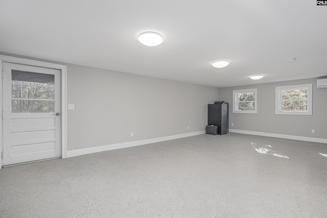 basement featuring an AC wall unit