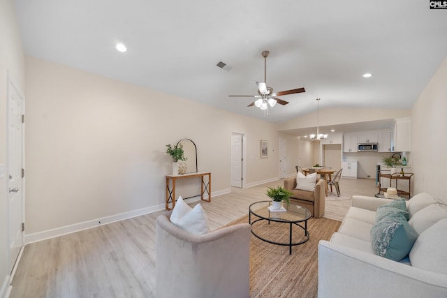 1758 Baughman Rd, Lugoff, SC 29078 - living area featuring light wood-style flooring, ceiling fan, lofted ceiling, and a chandelier